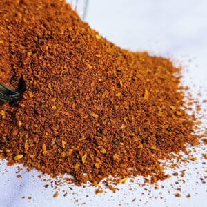 A pile of Booda's Berbere ~ Certified Organic on a white surface.