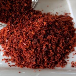 Korean Chile Pepper Flakes on a white plate.