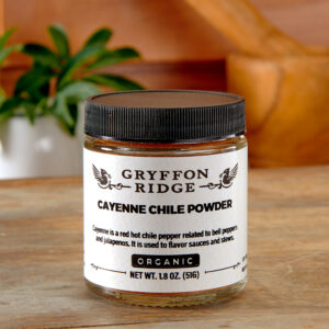 A bowl of Cayenne Chile Powder ~ Certified Organic on butcher block