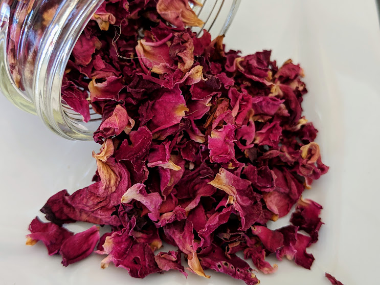 Red Certified Organic Rose Petals in a glass jar.