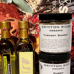 A bottle of Dipping Blends with Olive Oil, a jar of Dipping Blends with Olive Oil, and a jar of spices.
